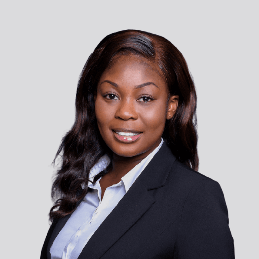 Headshot of Angela Mensah, smiling.